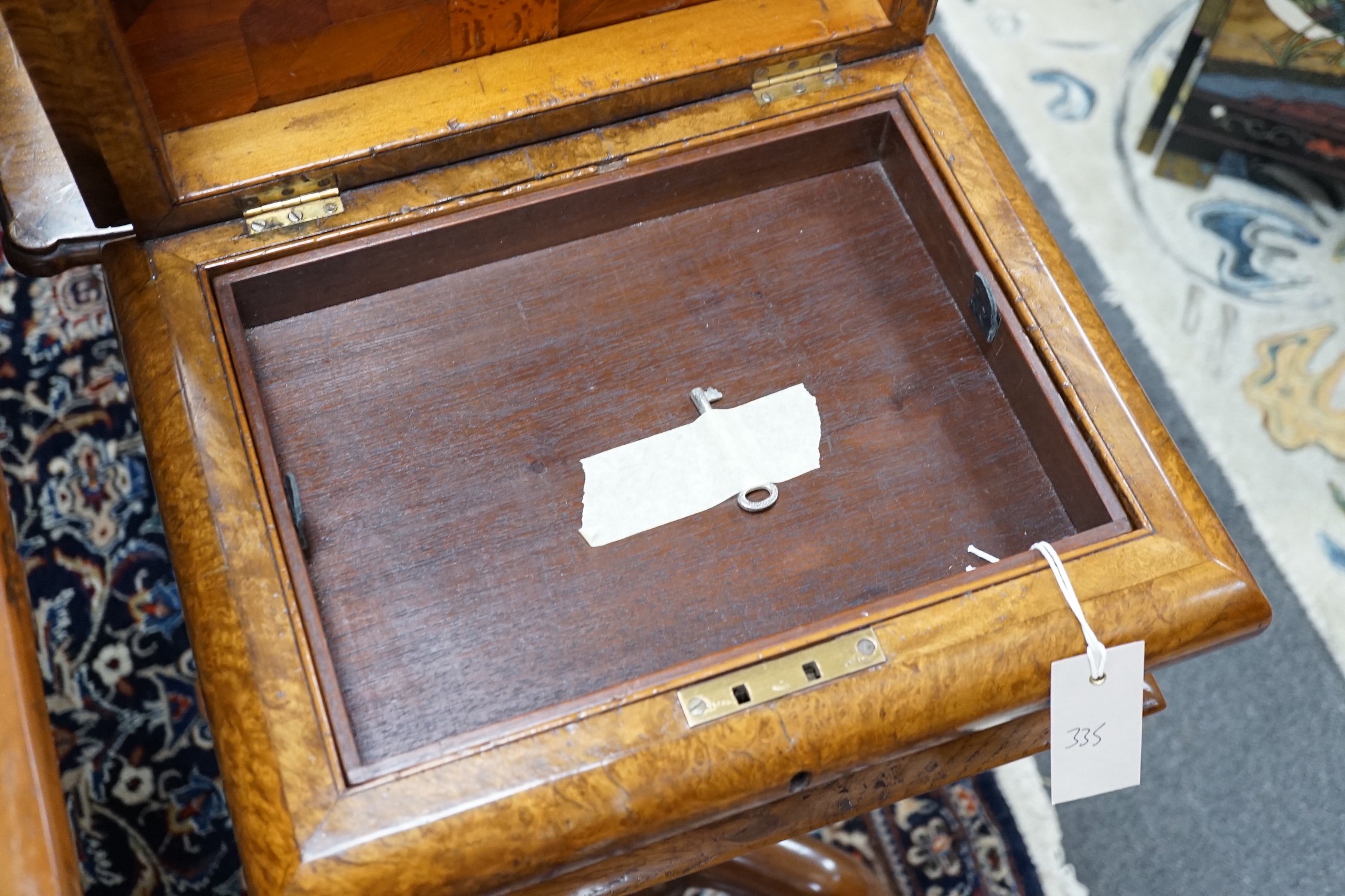 A Victorian burr walnut sarcophagus work table, width 38cm *Please note the sale commences at 9am.